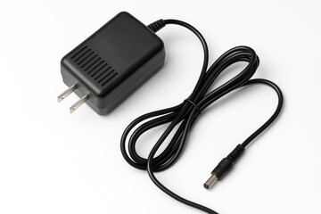 White background featuring an AC DC power supply adapter