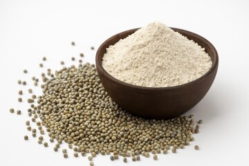 Pearl millet and sorghum grains with flour in a bowl, close-up focus
