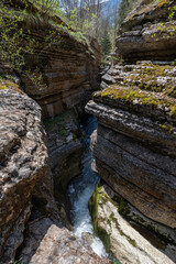 Mountain river in the forest. A beautiful view of Rosomacki Lonci in Slavinja, Serbia. Canyon of Rosomac river, called Rosomacki lonci ( Rosomac pots) or Slavinja throat, with curved and colored roc	