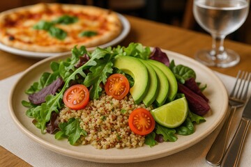 Detailed shot of a colorful and healthy grain salad featuring greens, creamy avocado, cherry tomatoes, lime, and beets on a dinner setting