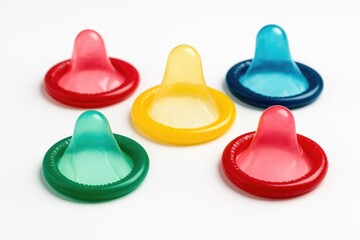 Vibrant condom illustrations on a plain white backdrop
