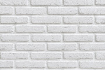 Obraz premium Close-up of white brick surface with intricate details for background, suitable for various design settings like homes, shops, cafes, and offices, featuring a painted brick wall and blank space.