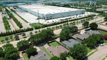 Suburban homes near large warehouses in Coppell, Dallas Fort Worth metroplex, growing hub for logistics, supply chain, distribution centers near DFW Airport, residential houses mixed-use zoning