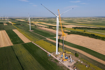 Wind turbine installation using a large construction crane. The assembly process of the turbine...