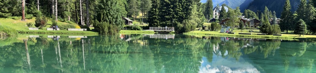 reflection in lake and mountains in gressoney italy 