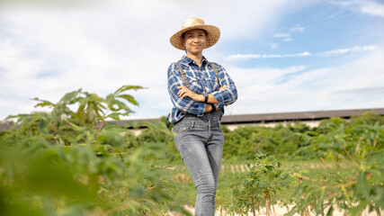 Woman Stands Proudly in a Farm Field at Midday