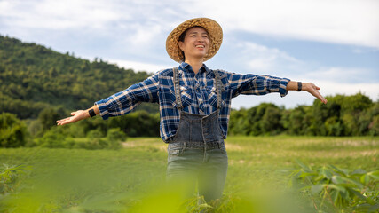Smiling Farmer Enjoying Nature in Green Fields