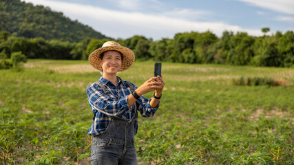 Smiling Farmer Takes Selfie in Rural Field Setting