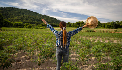 Woman Enjoying a Sunny Day in a Green Field