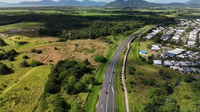 Smithfield, Cairns, Queensland, Australia 4K Aerial Footage Showing Highway, Smithfield Bypass, Road Infrastructure, Residential Suburbs, Construction Zone, Farmland, and Mountain Ranges in Tropical