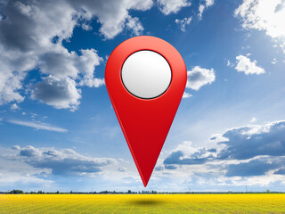 Large red map location pin icon standing on yellow grid field under blue sky with clouds,...