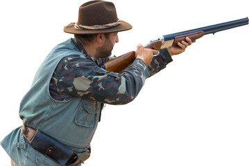 Silhouette of a hunter with a gun in the reeds against the sun, an ambush for ducks with dogs