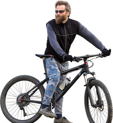 Sports brutal bearded guy on a modern mountain bike. Cyclist on the green hills in the spring.