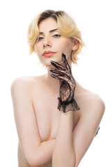 Obraz premium A young blonde girl with clean skin wearing black gloves. Beauty portrait of a woman on a white background in the studio.