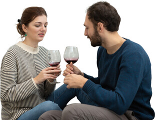Young and happy couple drinking wine and relaxing at home