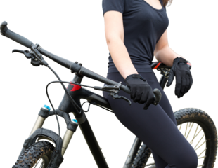 Girl on a mountain bike on offroad, beautiful portrait of a cyclist in rainy weather, Fitness girl rides a modern carbon fiber mountain bike in sportswear. Close-up portrait of a girl in red bandana.
