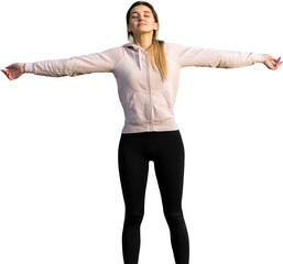 A young slim athletic girl in sportswear performs a set of exercises. Fitness and healthy lifestyle...