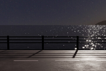 月光がキラキラ海面に反射する夜のガードレールがある海沿いの道
