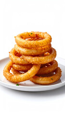 Delicious stack of crispy onion rings served on a white plate, perfect for appetizers or snacks.