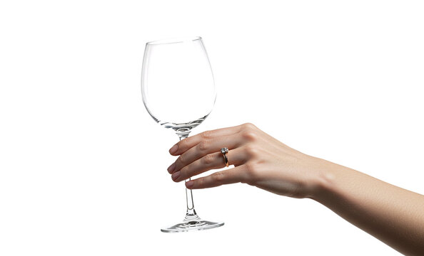 Hand holding empty clear transparent wine glass isolated on a transparent background 