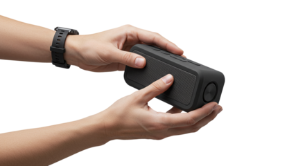 Hands holding black wireless portable speaker isolated on a transparent background  