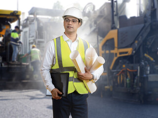 Man road architect. Foreman among construction equipment. Portrait of builder near road repair...