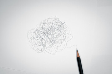 Complex, messy, chaotic pencil lines on white paper. Concept of chaos, problem solving and...