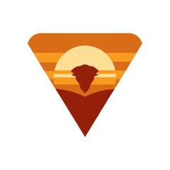 A Majestic Savanna Sunset Logo with a Lion Head in a Modern Triangle Badge