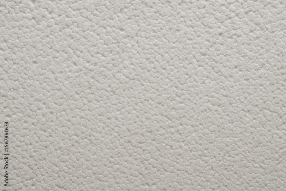 Poster close-up of a white foam block showing detailed texture, used as a building foundation, with a patte