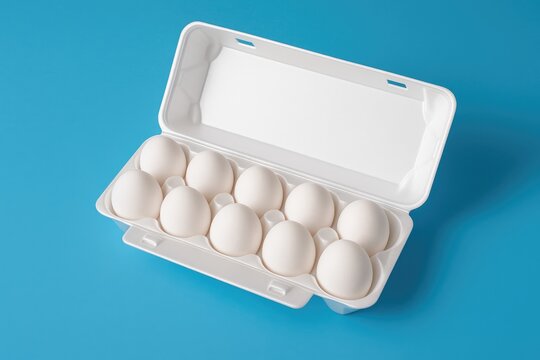 A white plastic egg holder set against a vibrant blue backdrop