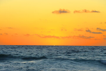 Beautiful sunset on the sea. The sun sets over the ocean.