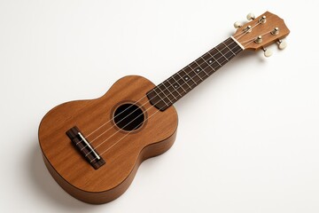 Fototapeta premium A wooden ukulele with a brown finish on a plain white backdrop