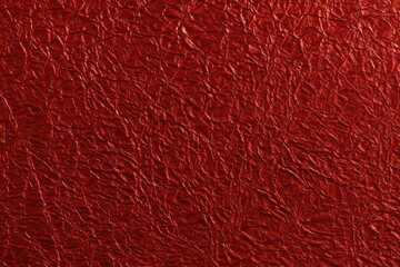 Top-down perspective of a textured red foil background
