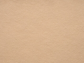 Warm beige felt surface showcasing a soft texture and a comforting, neutral tone