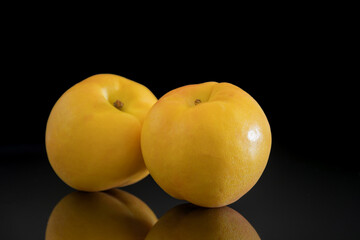 Yellow peach with black background