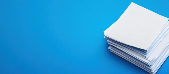 Stack of Papers on Blue Background