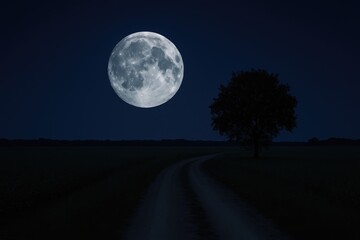 A luminous full moon casting its glow over a tranquil blue sky and a quiet countryside road