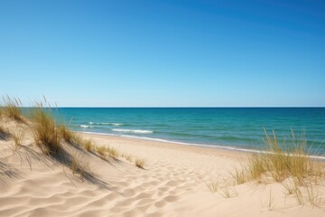 Scenic coastal scene with bright sunshine and tranquil waters from a sandy dune beach. Azure sky and vibrant turquoise ocean. Picturesque natural landscape, perfect for eco-friendly travel and