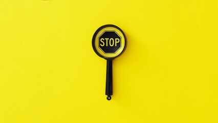 Stop and Think is shown using the text on the sign STOP under the magnifying glass