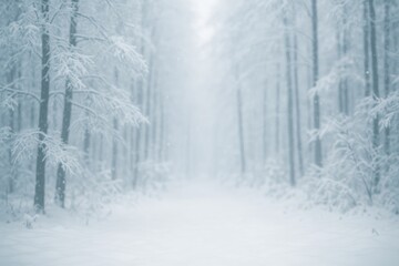 Fototapeta premium Winter scene featuring snow-laden trees and a softly blurred forest backdrop