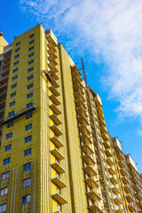 Moscow, Russia - June 17, 2025: construction of a modern apartment building, vertical photo.
