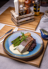 Salmon steak with zucchini slices