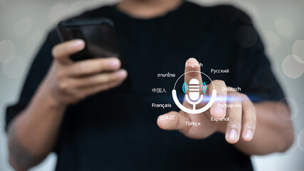 Close-up of a hand using a voice assistant and speech recognition app on a smartphone with multiple...