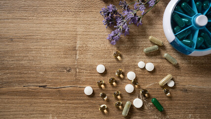 Exploring the wellness journey with an assortment of vitamins and herbal supplements arranged...