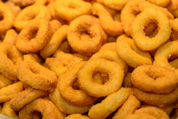 Golden fried squid rings pile up. Delicious snacks.