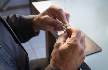 Hands making a cigarette