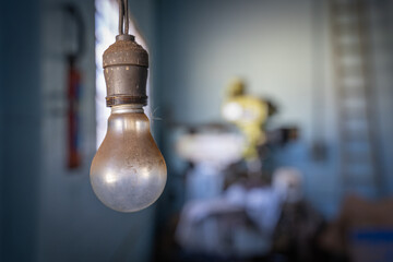 Halogen lamp turned off, in a blurred background