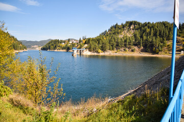 Big lake in the mountains with a beautiful view from a bridge.