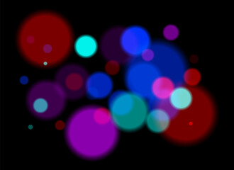 Colorful blurred circles on dark background with smooth soft edges. Overlapping glowing bokeh creates dreamy abstract depth and festive atmosphere without clear focal point.