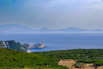 Fototapeta premium Scenic View of Cape Lefkada Lighthouse and Ionian Sea from Afar, Greece